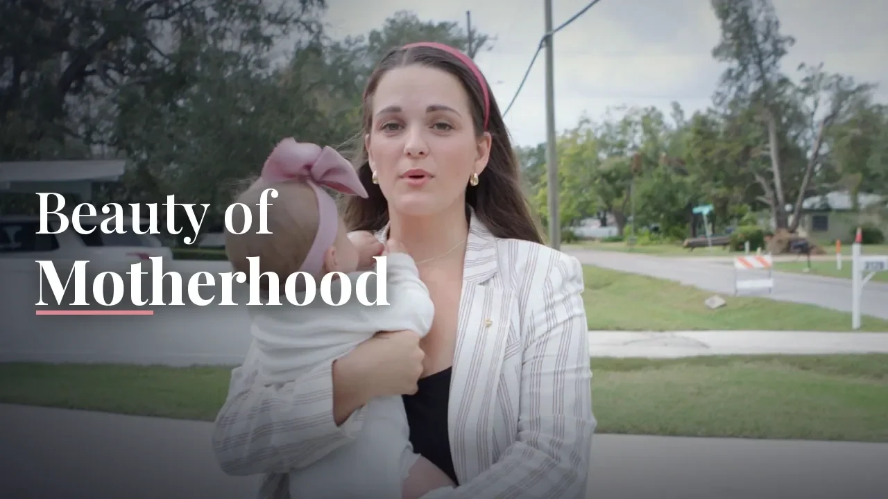 Savannah Evans holding a baby outdoors beside the title Beauty of Motherhood: A Tampa Pilot Documentary